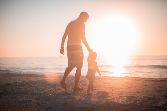 Father and son enjoying the beach