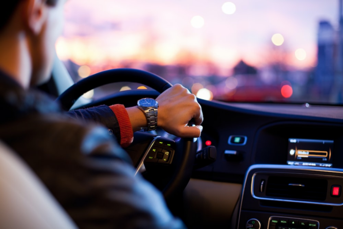 A man driving a vehicle