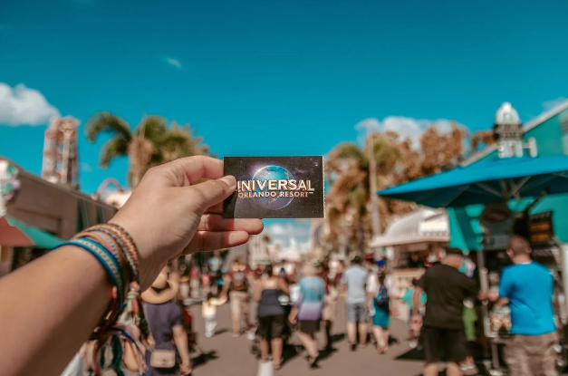 Person holding the ticket to Universal Orlando Resort.