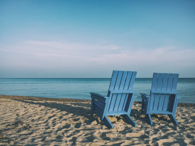 Blue beach chairs by the sea