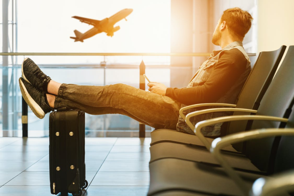 man at the airport traveling for a vacation