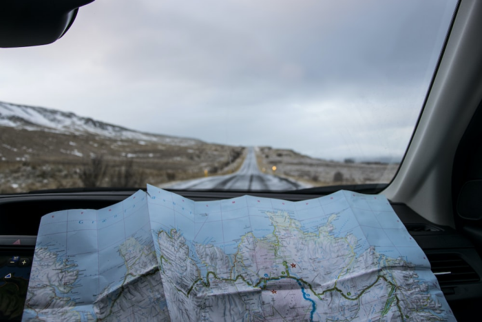 Map next to the windshield of a car