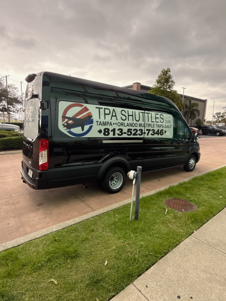 Black van with TPA shuttles advertisement parked outside.